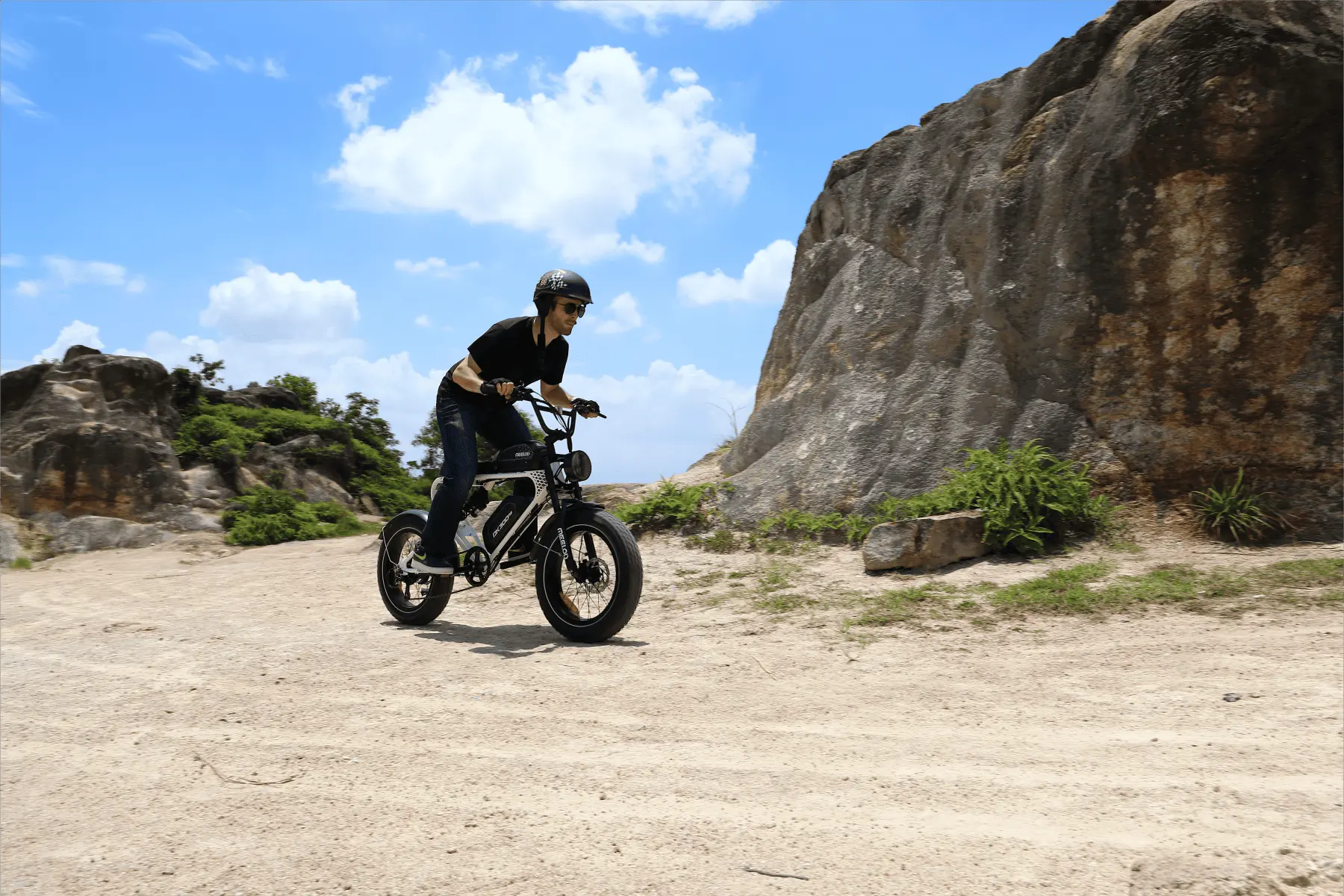 Person test-riding a moped ebike in a store