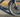 Fat tire e-bike riding on sandy terrain with wide tires