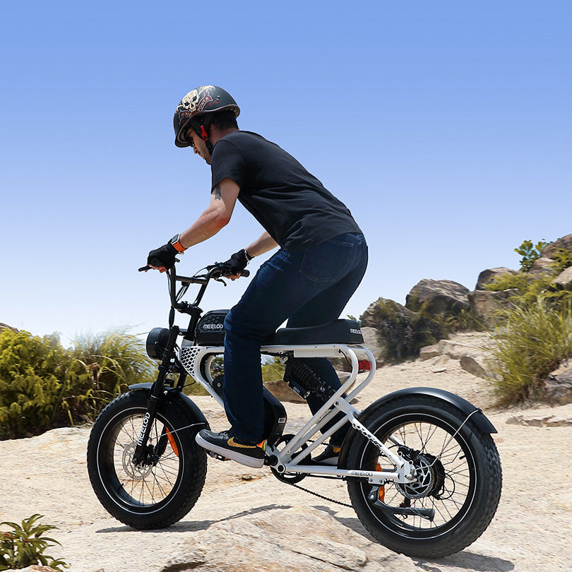 A man riding a white Meelod DK300PLUS